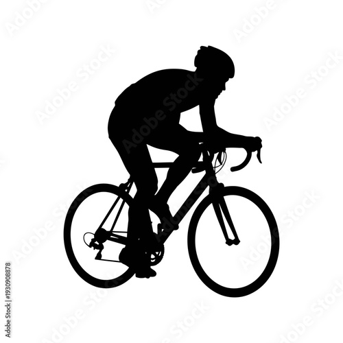 Silhouette of a cyclist in motion on a road bike during outdoor training session with emphasis on form and speed.