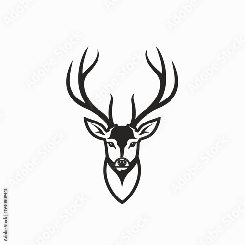 Minimalist deer head silhouette with antlers on white background
