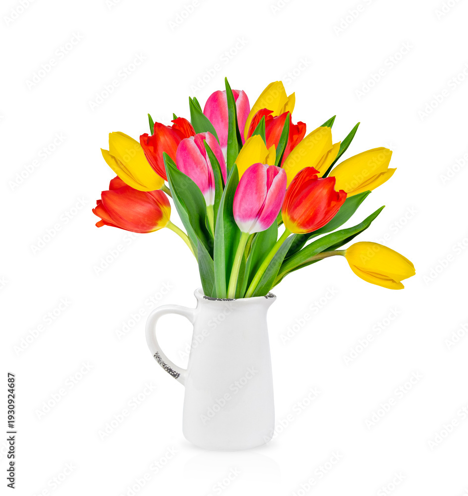 Obraz premium A bright bouquet of red, yellow, and pink tulips, elegantly arranged in a delicate white ceramic jug. Isolated on a white background.