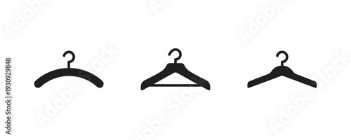 Group of bold solid black icons depicting different styles of clothing hangers