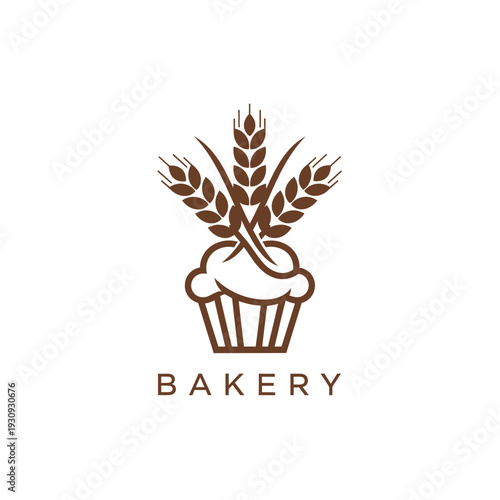 Bakery logo design with a cupcake and wheat stalks, fresh organic baking symbol