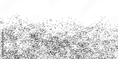 Black particles splash on a white background. Black powder dust scatters below art background