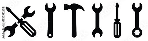 Group of six different tools including hammer, wrenches, and screwdrivers