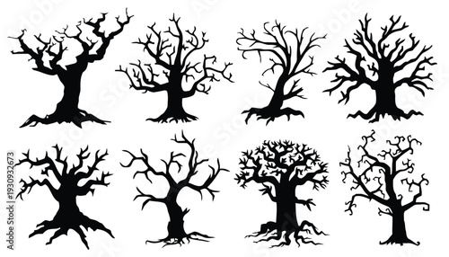 Group of spooky bare tree silhouettes in various gnarled shapes