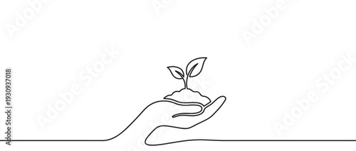 Hand holding plant sprout with soil represents new life, growth, and the vital concept of environmental care and sustainability for a better future.