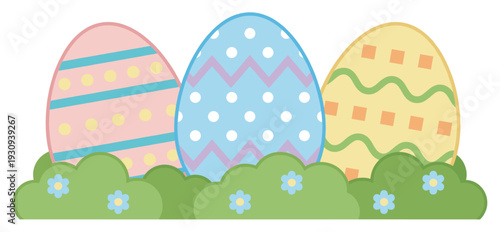 Three colorful decorated Easter eggs nestled among green bushes with small blue flowers, celebrating the spring holiday.