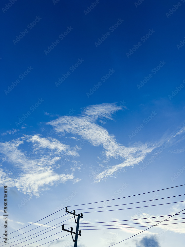 Fototapeta premium Telephone Pole Against Blue Sky