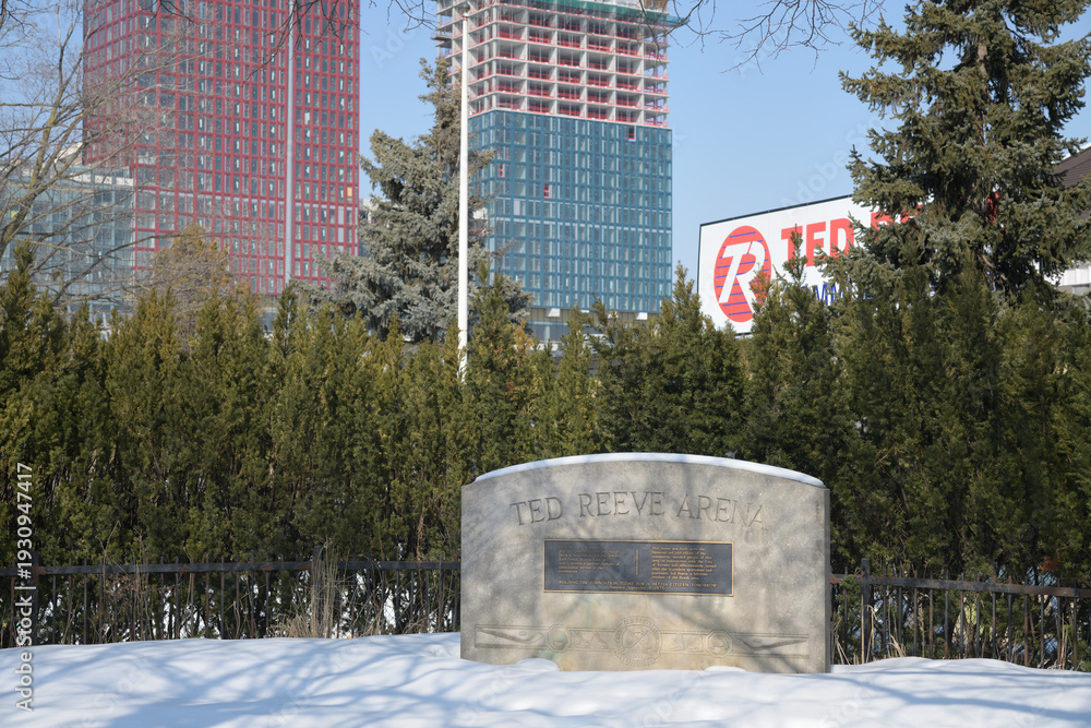 Naklejka premium plaque and location marker near Ted Reeve Community Arena located in East Toronto Athletic Field, 175 Main St (seen from Gerrard St E), Toronto (with Main Square Redevelopment behind)