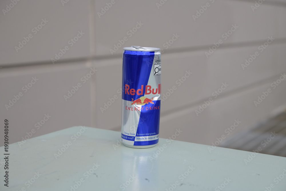 Obraz premium dented discarded can of Redbull energy beverage in Toronto