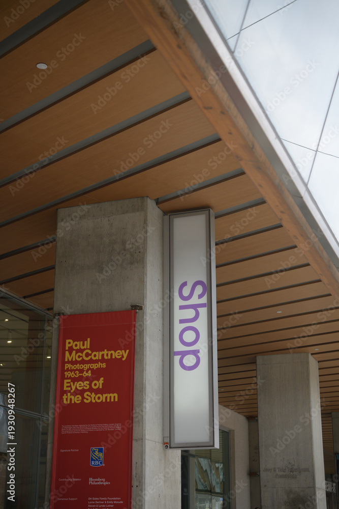 Fototapeta premium exhibition banner and shop sign outside the Art Gallery of Ontario, 317 Dundas St W, Toronto