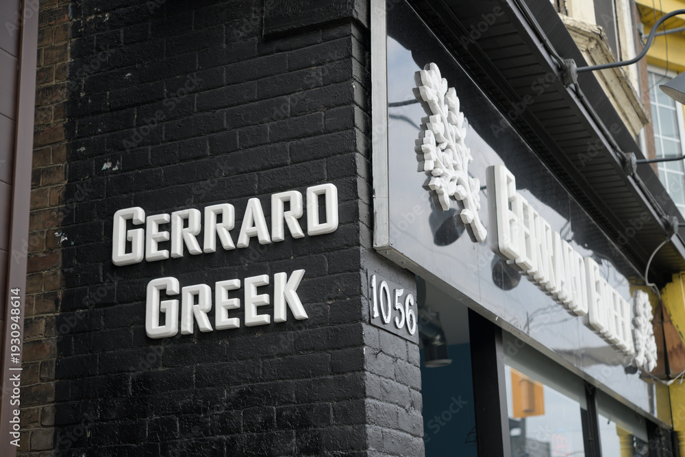 Fototapeta premium exterior building facade and sign of Gerrard Greek, a restaurant, located at 1056 Gerrard St E, Toronto