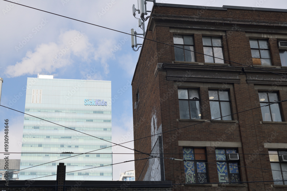 Fototapeta premium looking north from Dundas St W to SickKids Peter Gilgan Centre for Research and Learning building, Toronto