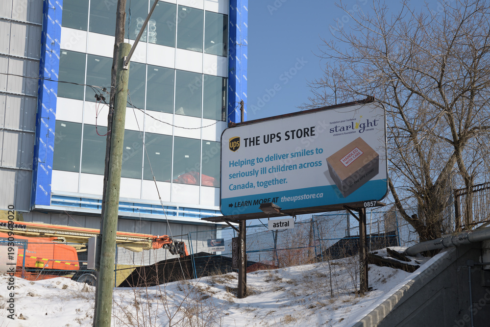 Fototapeta premium traditional roadside billboard with UPS Store advertising, Victoria Park Av, Toronto