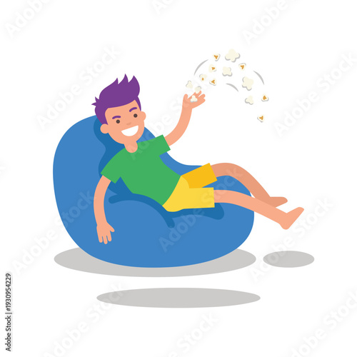 Young man relaxing on a blue beanbag chair throwing popcorn.