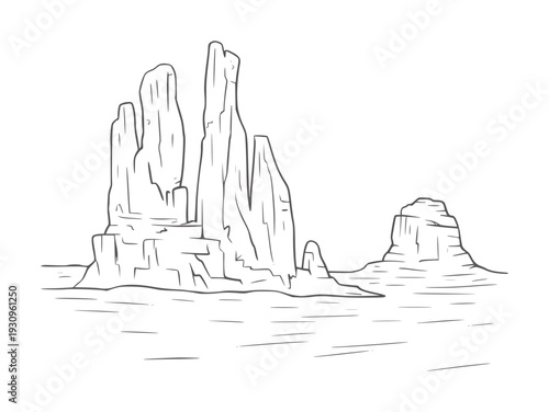 Black and white line of towering rock formations in a desert landscape