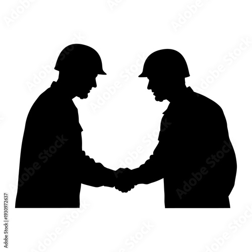 Two silhouetted professionals shake hands in a mutual business agreement and partnership.