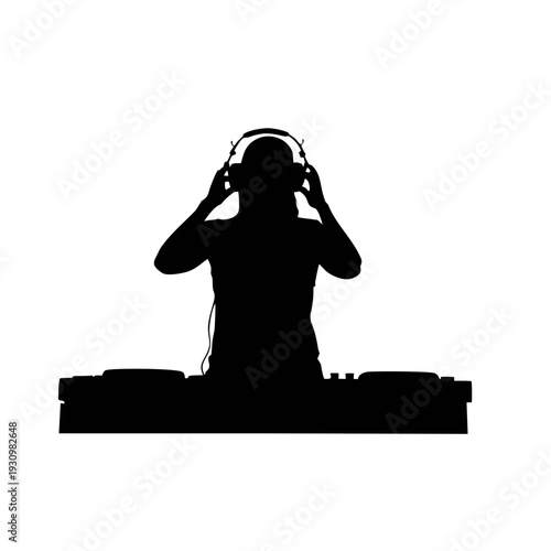 DJ in silhouette adjusting headphones at turntable