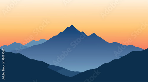 Sunset over misty mountain landscape with morning clouds and hills
