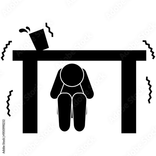 地震で机の下に隠れる人のピクトグラム