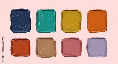 Assorted paint swatches arranged in a grid pattern on a soft pink background, viewed from directly above