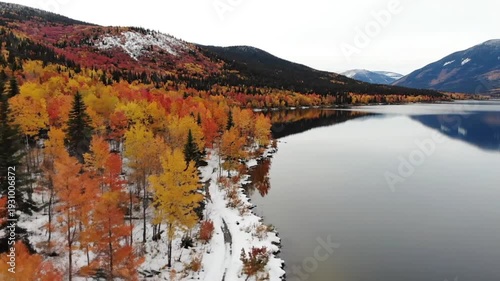 Wallpaper Mural Autumn forest and snow-dusted mountains reflected in peaceful lake Torontodigital.ca