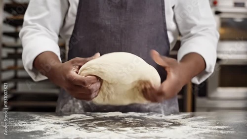 Wallpaper Mural Baker kneading dough on floured counter in professional kitchen Torontodigital.ca