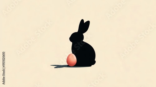 Silhouette of bunny with easter egg: minimalist artistic design