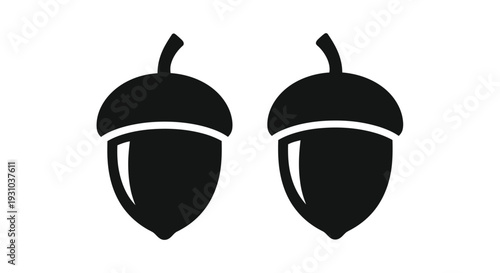 Two black acorns depicted in a simple graphic illustration