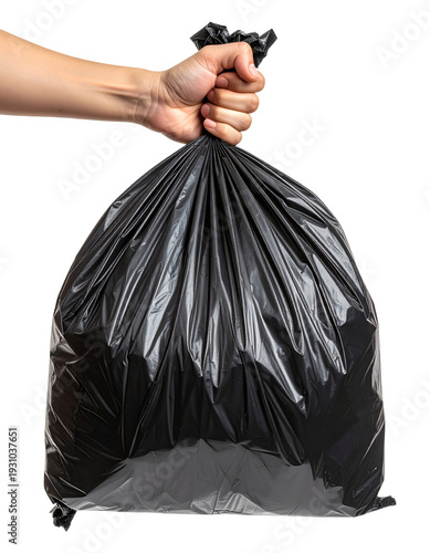 A clean hand firmly grips the gathered top of a large, full black garbage bag ready for disposal or recycling collection 