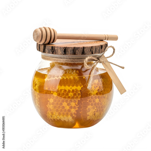 A jar of golden honey with a wooden lid and a honey dipper on top.