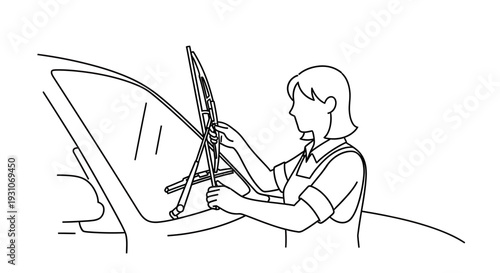 Woman replacing car windshield wiper blade, close-up, outdoor