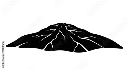 Distinctive black silhouette of a rugged landform featuring prominent surface cracks