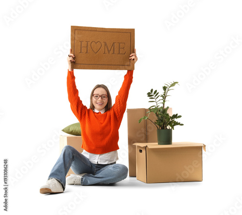 Young woman with doormat an...