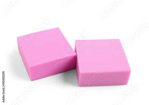 Pink rubber erasers on whit...