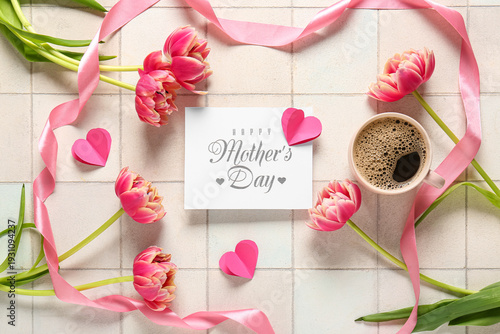 Greeting card with text HAPPY MOTHER'S DAY, ribbon, cup of coffee and tulip flowers on white tile background