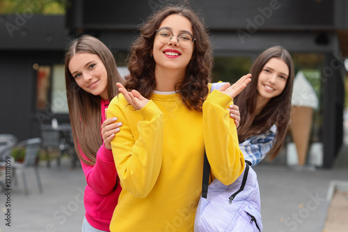 Happy teenage girls in park