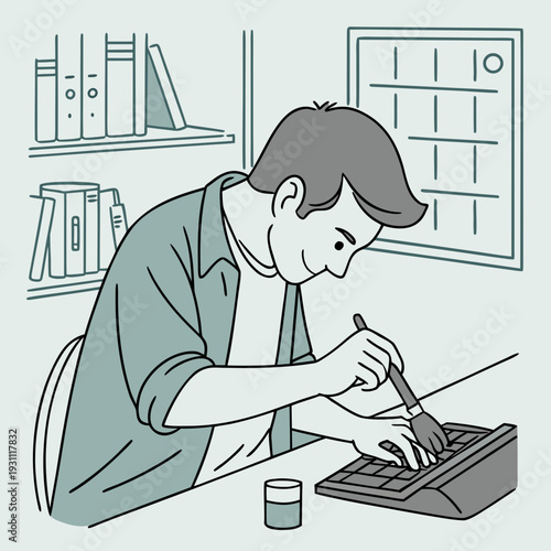 Man cleans computer keyboard with a brush at home