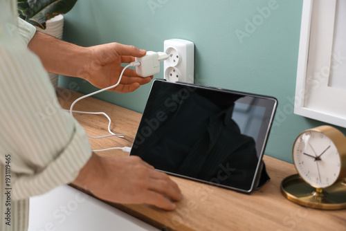 Young man with tablet inser...