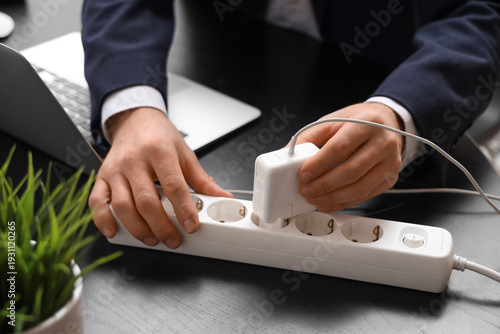 Businessman with laptop ins...