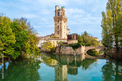 Specola museum with water reflections in Padua, Veneto, Italy; museum of the astronomical observatory of Padua on river Bacchiglione  waterfront