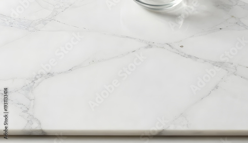 a minimal white Carrara marble slab, realistic grey veining pattern, soft natural daylight, a subtle shadow from an unseen glass bowl on the upper edge