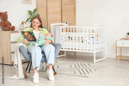 Beautiful young mother read...