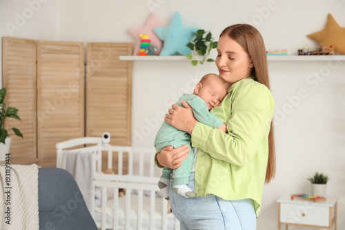 Beautiful young mother with...