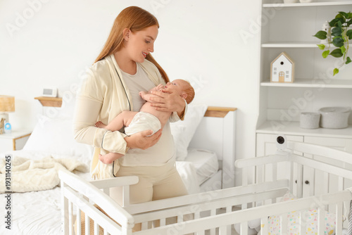 Beautiful young mother with...