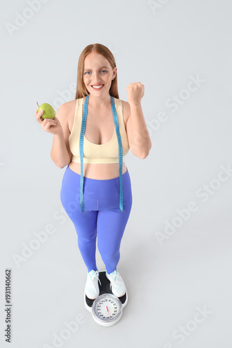 Young happy overweight woma...