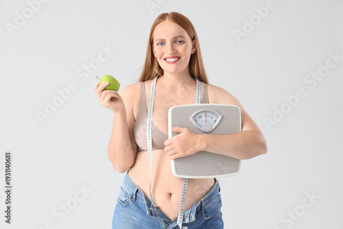Young happy overweight woma...