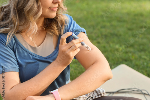 Diabetic sporty woman using...
