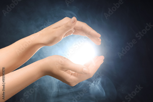 Female hands with ball of e...