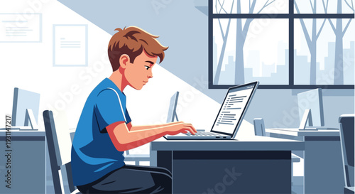 Young Man Working on Laptop Computer.