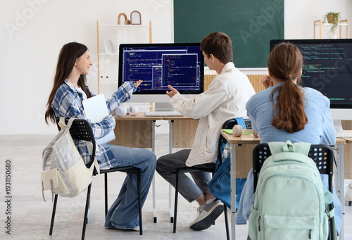 Teenage students studying a...
